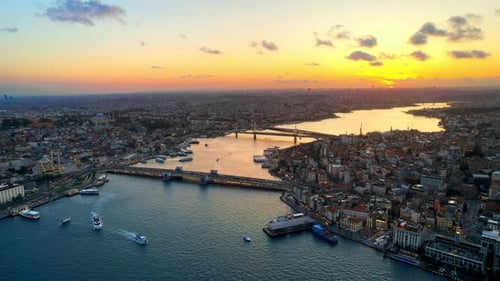 Aerial drone view of Istanbul at sunset, Turkey. Multiple residential buildings, mosques, Galata and