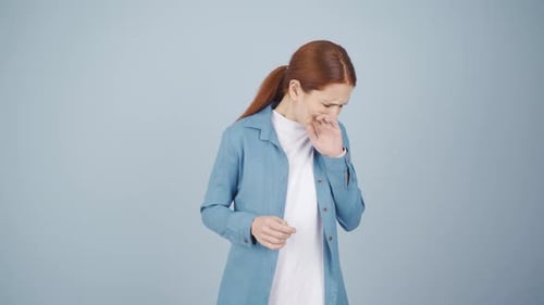 Woman Coughing and Displaying Sickness Symptoms