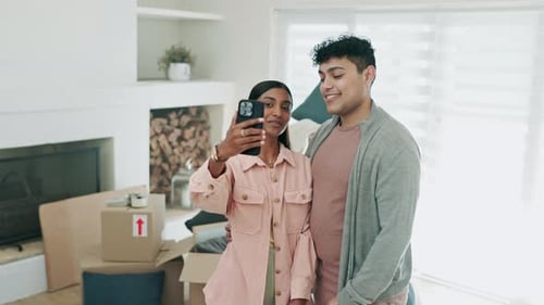 Happy Couple Taking Selfie in New Home