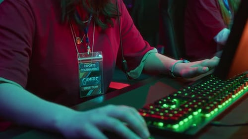 Excited Geeky Teenage Girl Participating in Video Game Tournament in Club