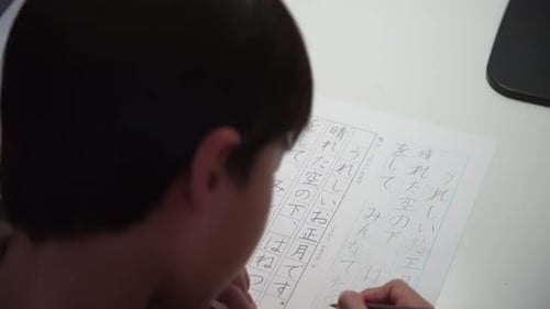 A boy practicing calligraphy