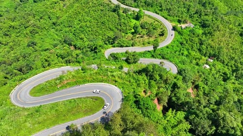 Aerial view of a dangerous winding highway in the jungle.