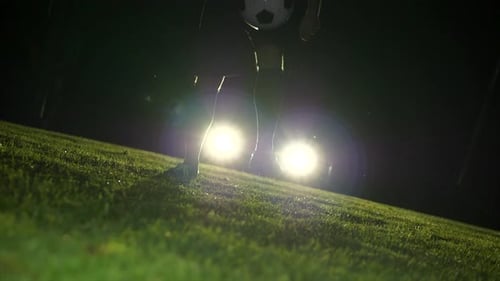 Soccer Player Athlete Training Foot Ball Sport on Soccer Field at Night