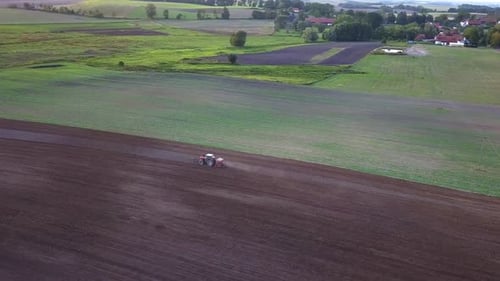 Tractor Plowing Aerial Shot. Drone Footage Of A Tractor Plowing A Field. Countryside Aerial Shot.