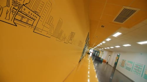 Urban Skyline Picture on Yellow Wall in School Hallway