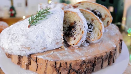 Pie with Poppy Seeds and Raisins on the Festive Table Bread on a Wooden Stand Festive Table with