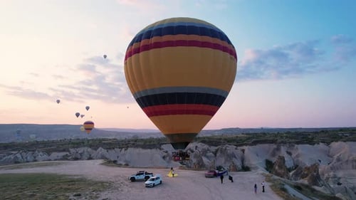 Photo Zone In Cappadocia With Balloons. Hot Air Balloon Flies Close To The Ground