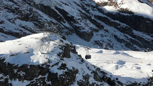Aerial view, Gondola In a Swiss alps mountain to transport skiers and winter sports enthusiasts