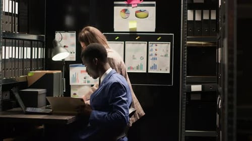 Workers Reviewing Data at a Desk