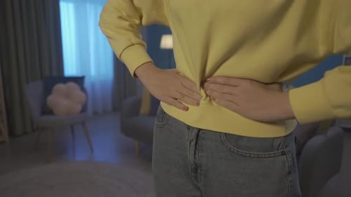 Woman Experiencing Abdominal Pain Close Up