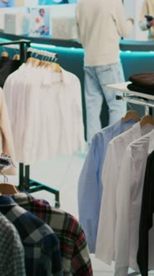 Shoppers Browsing Clothes in a Trendy Retail Store
