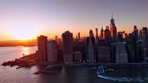 Panorama of Manhattan, New York, the USA. Beautiful architecture lit with orange light