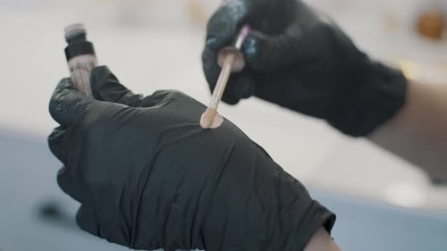 Cosmetic Professional Preparing Liquid Foundation Close Up