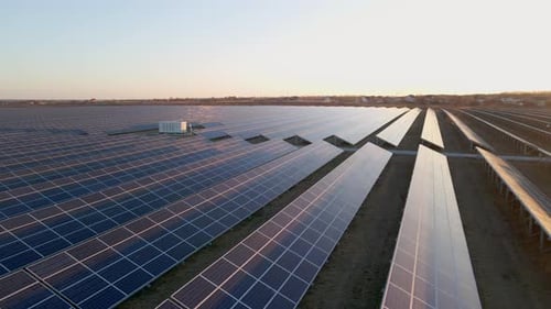 Aerial Close Up View of Solar Panels Stand in a Row in the Fields Power Ecology Innovation Nature