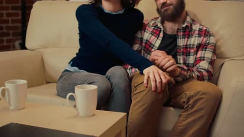 Couple Holding Hands During Therapy Session