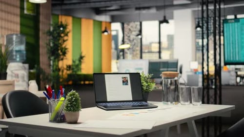 Empty Company Space with a Laptop Showing CV Applicant Before Job Interview