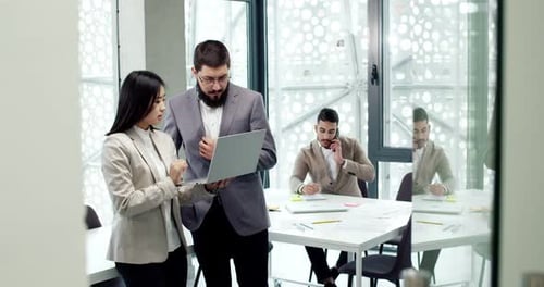 Two Attractive Busy Smart People Working in Modern IT Office Discussing Strategy Beautiful Young