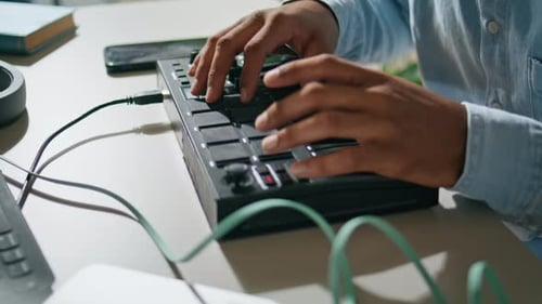 Man Hands Playing Midi Keyboard in Studio