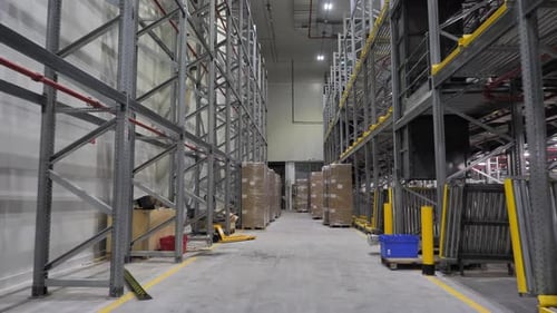 Pallets of cardboard boxes ready for shipment in warehouse, supply chain management concept