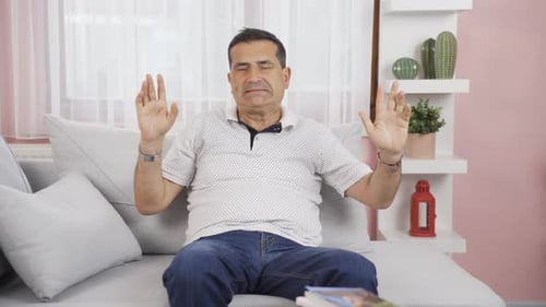 Happy man dancing at home.