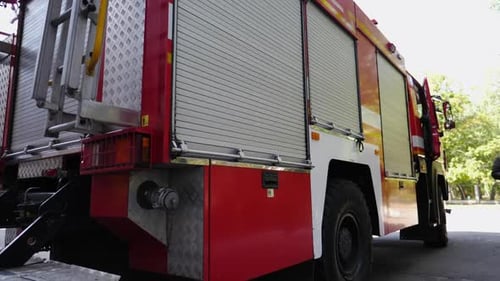 Firefighters Getting Equipment From Fire Truck