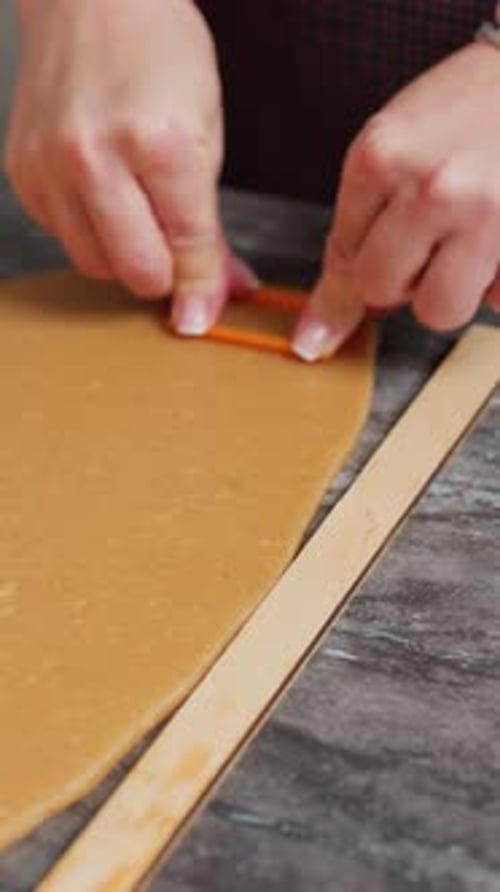 Cutting Cookie Dough with a Plastic Cookie Cutter