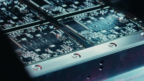 Factory Machine at Work: Printed Circuit Board Being Assembled with Automated Robotic Arm, Surface