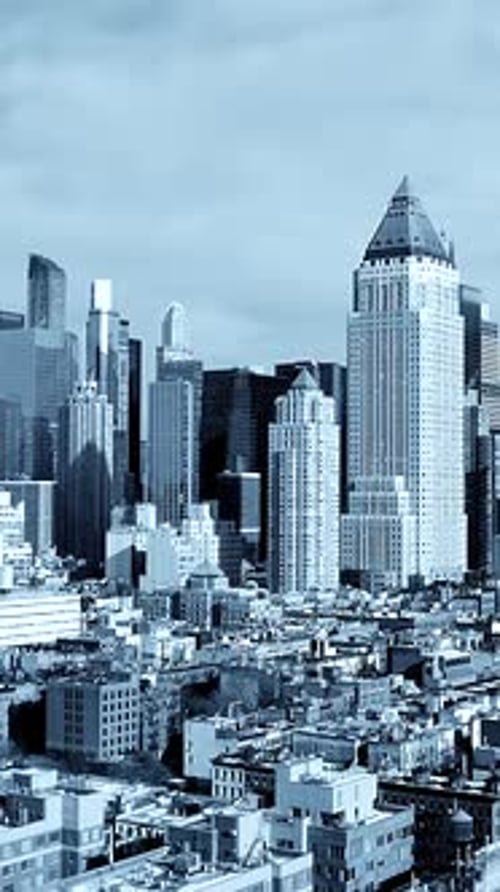 Modern Urban Landscape A Stunning Aerial View of Skyscrapers Set in a Beautiful Blue Tone