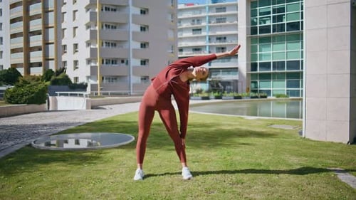 Sport Woman Stretching Body in Sunny Morning Active Girl Training in Urban Park