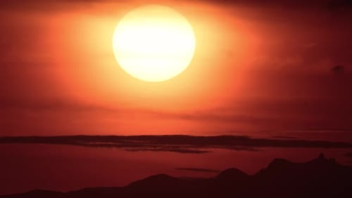 Vibrant Sunset Time Lapse over Mountain Silhouettes