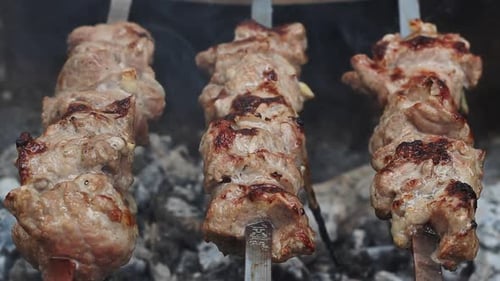Bbq Meat Skewers Grilling at Picnic Party. Close Up Cooking Shish Kebab