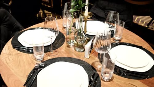 Elegantly made empty dinner tables in a chic restaurant shot with a slider