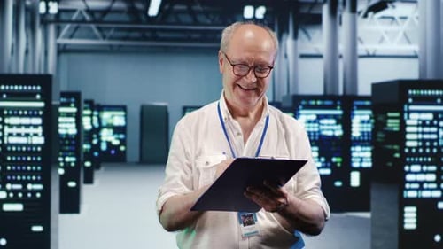 Man Inspecting Servers in Modern Data Center