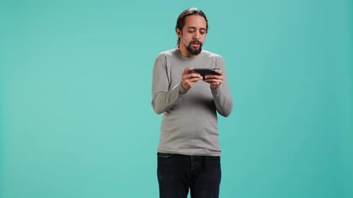 Gamer Participates in Gaming Competition Using Mobile Phone
