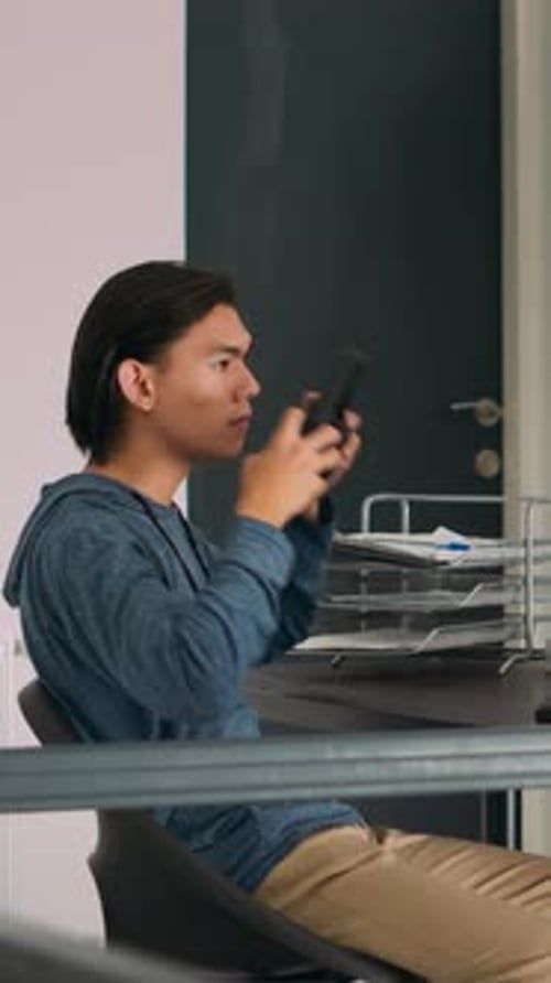 Vertical Video Asian Web Developer Programming Firewall Server on Terminal Window