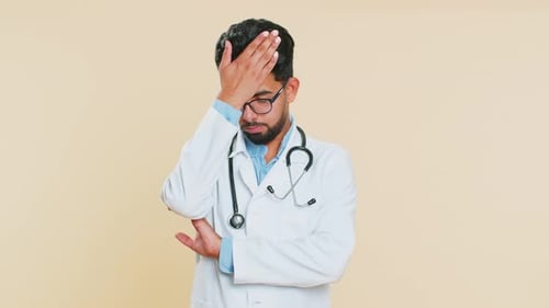 Distressed Doctor Expressing Overwhelm and Frustration