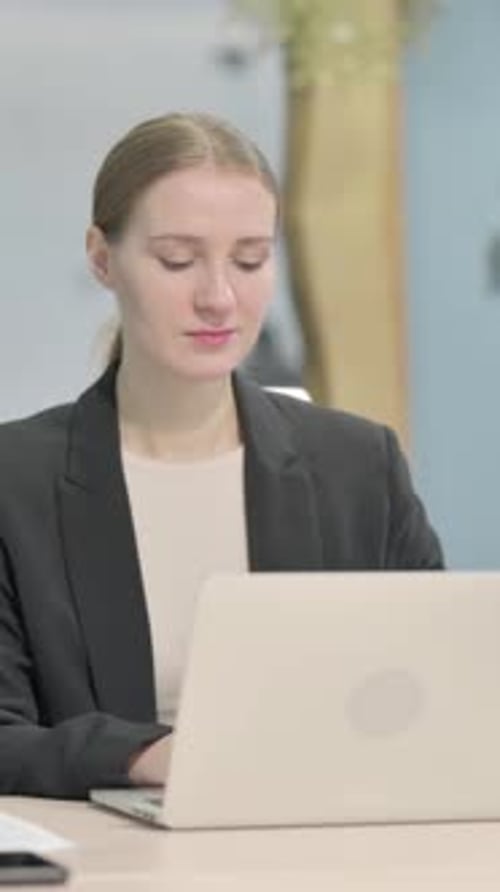 Busy Businesswoman Typing on Laptop in Office, Vertical Video
