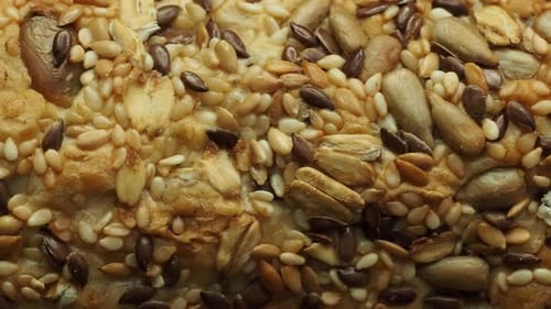 Close up of bread covered in a variety of seeds