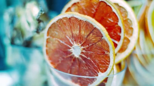 Sliced Fruits of Grapefruit. Sliced Slices of Fresh Grapefruit in Glass. Red