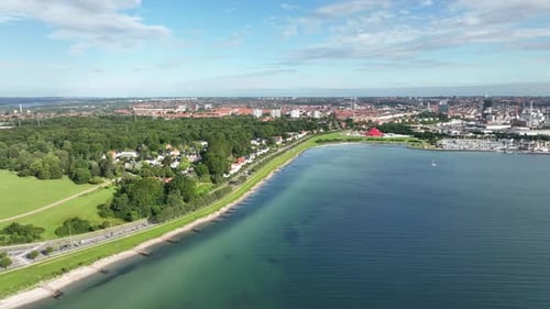 Aarhus Denmark panoramic cityscape aerial and establishing scene - Seen with Marselisborg beach in f