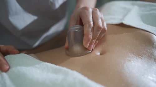 young woman receiving vacuum massage, close up