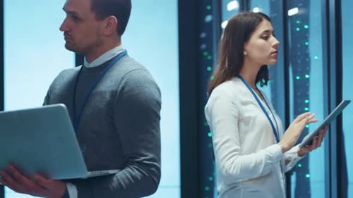 Professionals Engaging in Collaborative Efforts Within a Data Center Environment Setting