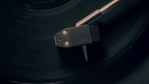 Record Player Needle on Spinning Vinyl Record Close Up