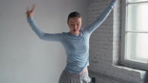 Young Dancer Freestyling on Camera in Minimalist Studio