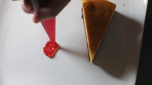 Chocolate Cheesecake gets a Red Drizzle Topping