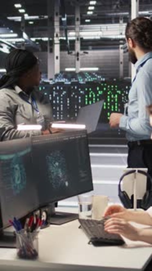 Vertical Video Data Center Engineers Performing Maintenance on Servers Used for AI