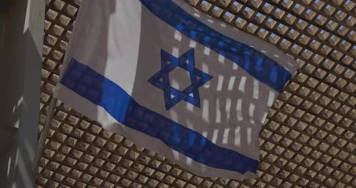 Israeli Flag Waving in the Daytime Light