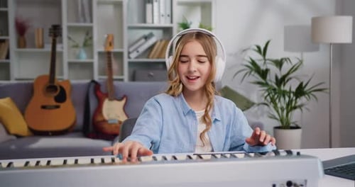 Girl Playing Electric Piano at Home