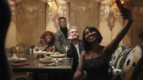 Black Woman and Her Multi Ethnic Friends Taking Selfie By Smartphone in Restaurant Happy People