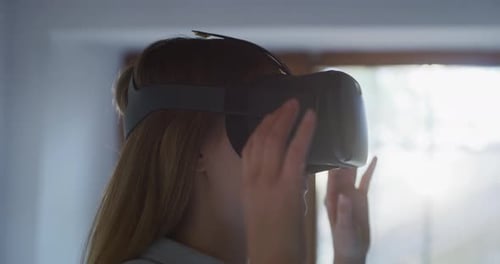 Close up shot of an Young Woman is Using Innovative Technology VR Glasses for Play Games and Relax